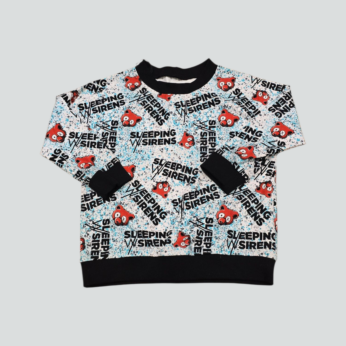 Sweatshirt with 'Sleeping w/ Sirens' logo and text on a light gray background