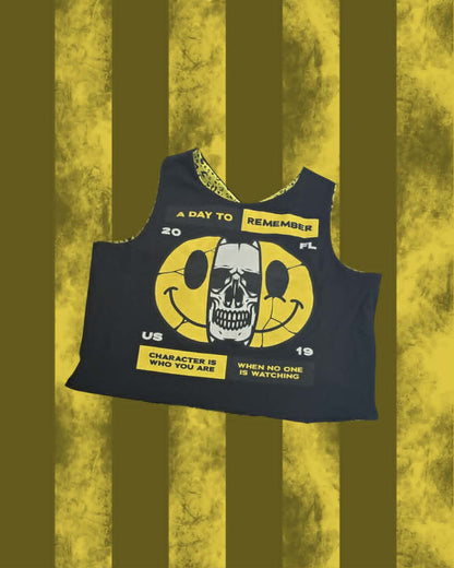 A sleeveless black cross-back A Day to Remember top