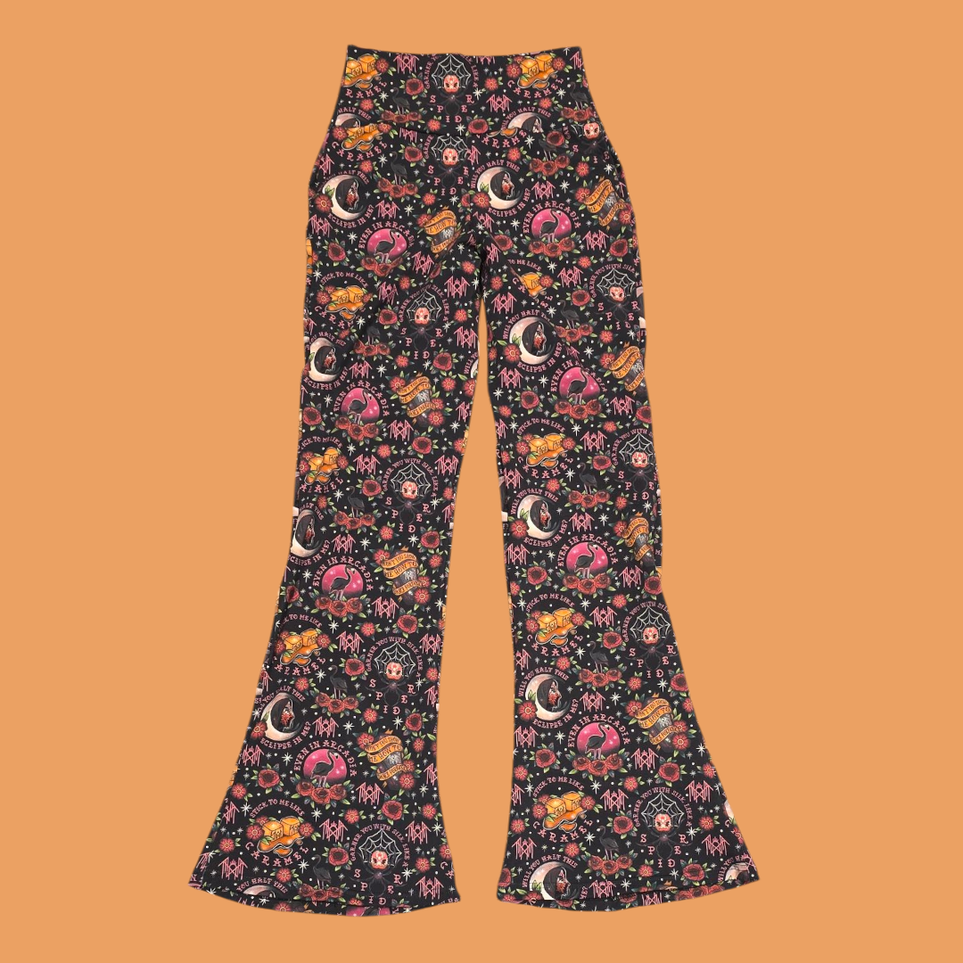 Flared pants with a colorful pattern on an orange background