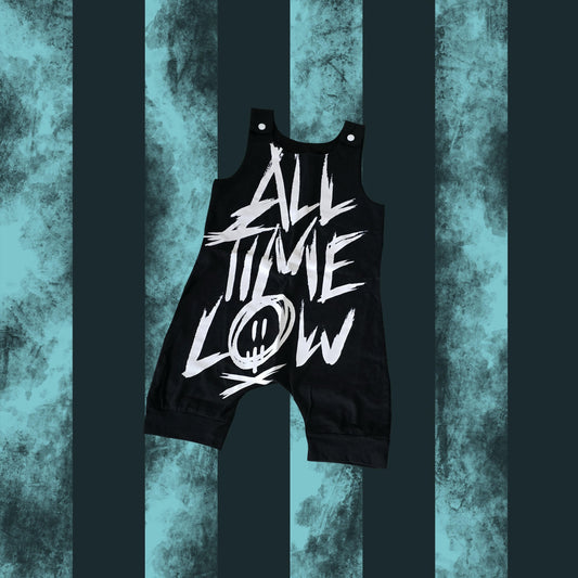 A black sleeveless romper for toddlers with the text 'ALL TIME LOW' printed in white.