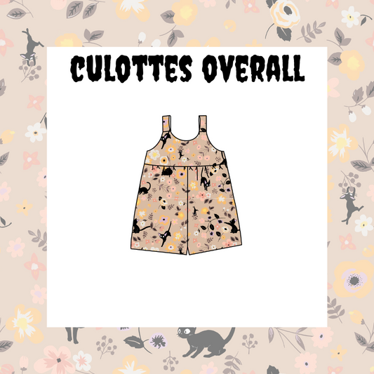 A floral overall for kids, with short sleeves and a sack-style waistband, displayed against a background with a similar floral pattern.