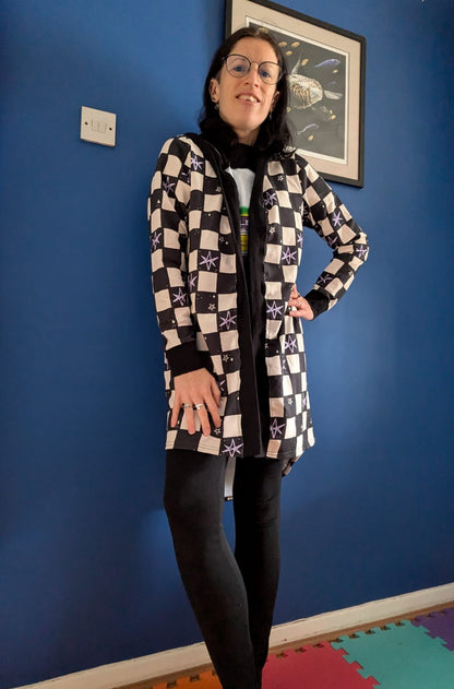An Alt Originals customer wearing a handmade alternative Drop-Back Cardigan