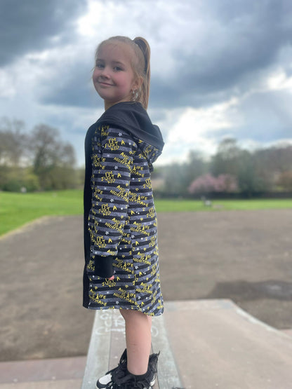 An Alt Originals customer wearing a handmade alternative drop-back cardigan