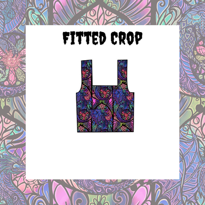 A fitted crop top with a multicolored floral design on a white background.
