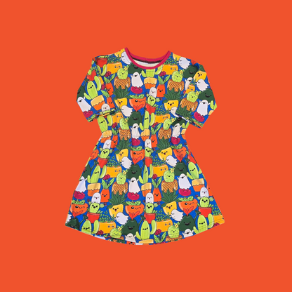 Colorful dress with plant pattern on an orange background