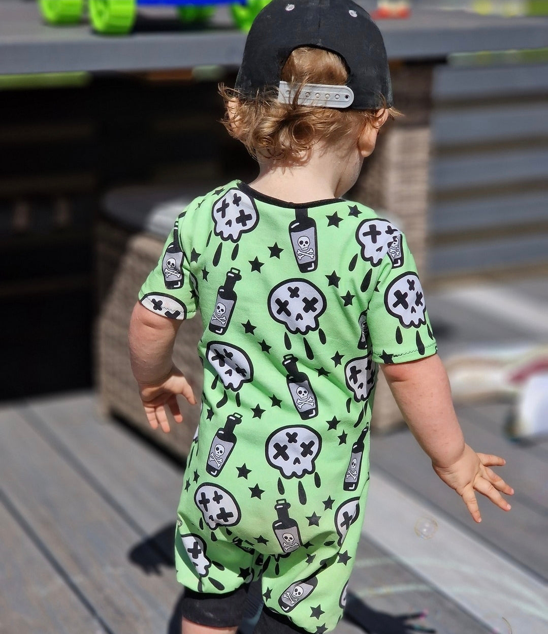 An Alt Originals customer wearing a handmade alternative pull-on romper