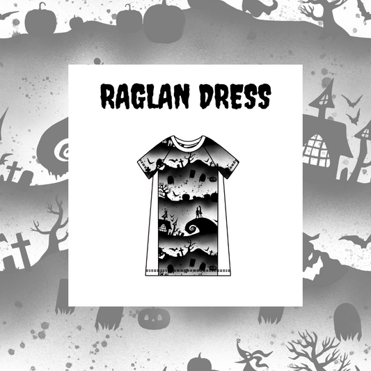 Kids' Raglan dress with a black and white Halloween-themed graphic design, featuring ghosts, pumpkins, and a haunted house.