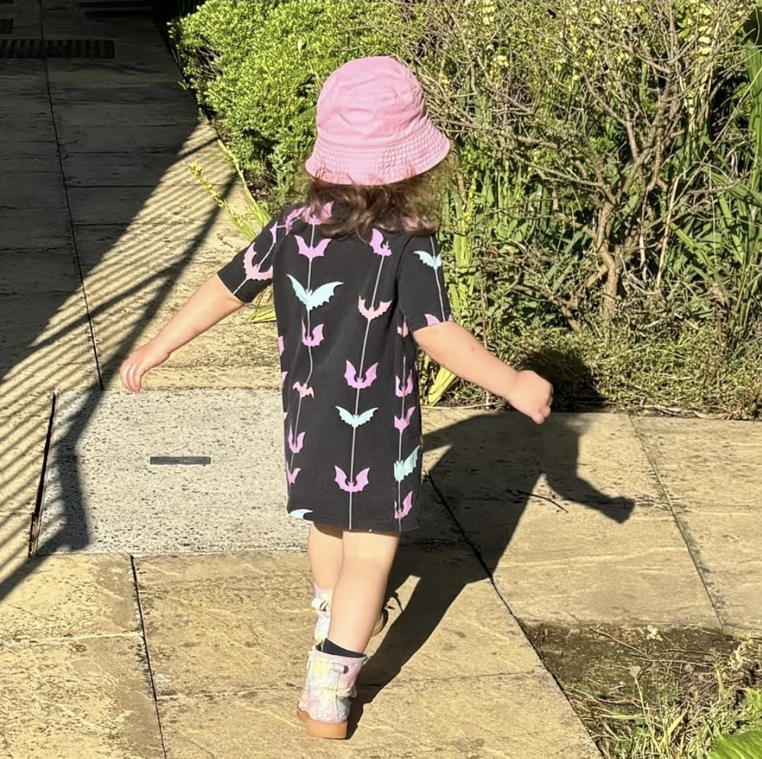 An Alt Originals customer wearing a handmade alternative raglan dress