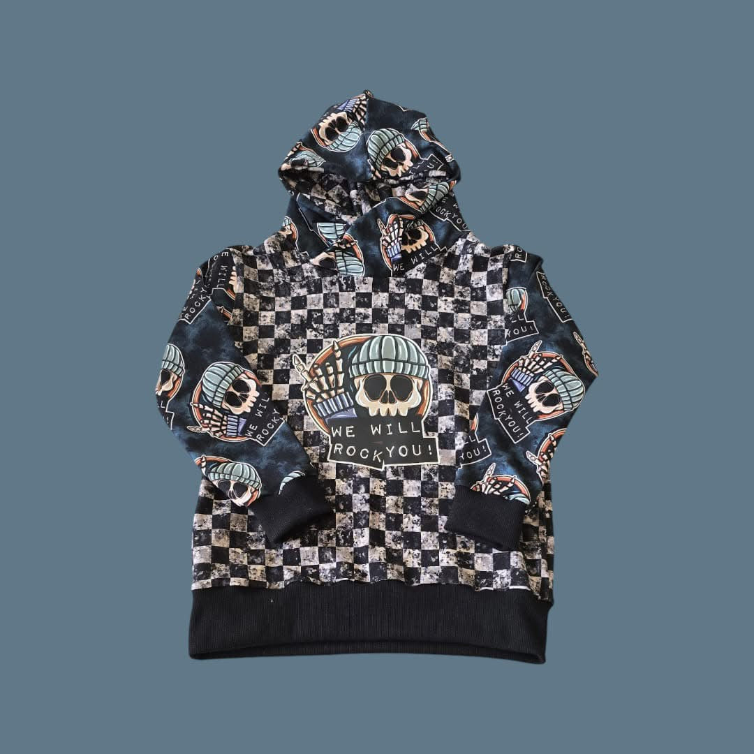 A hooded top with checkerboard body and printed WE WILL ROCK YOU