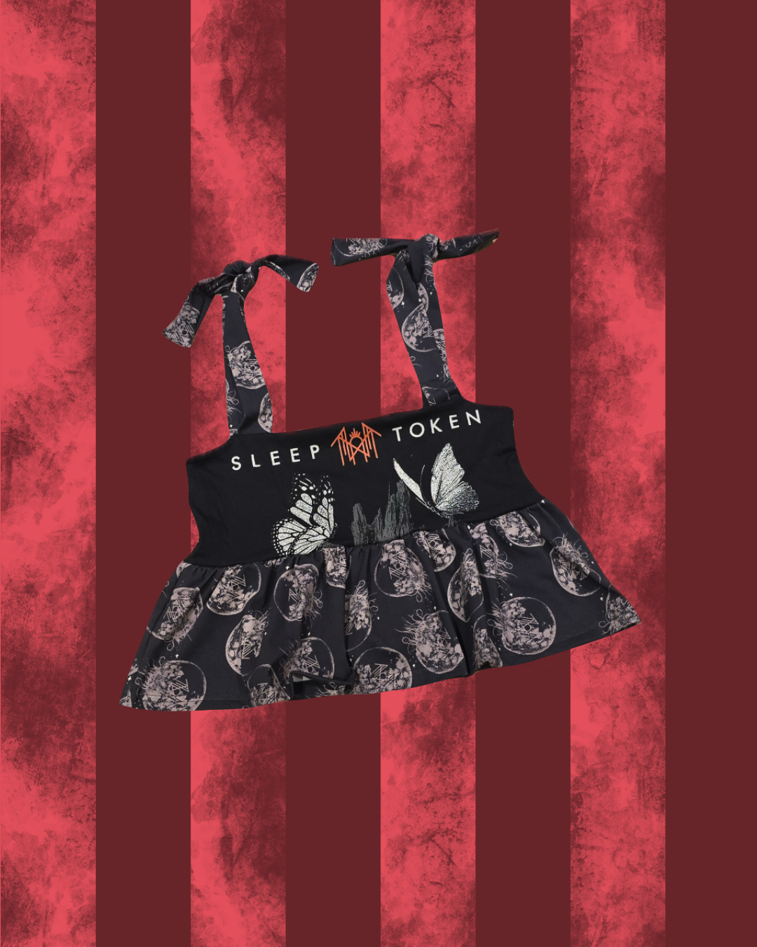 Black SLEEP TOKEN smock top with butterfly pattern on a red striped background