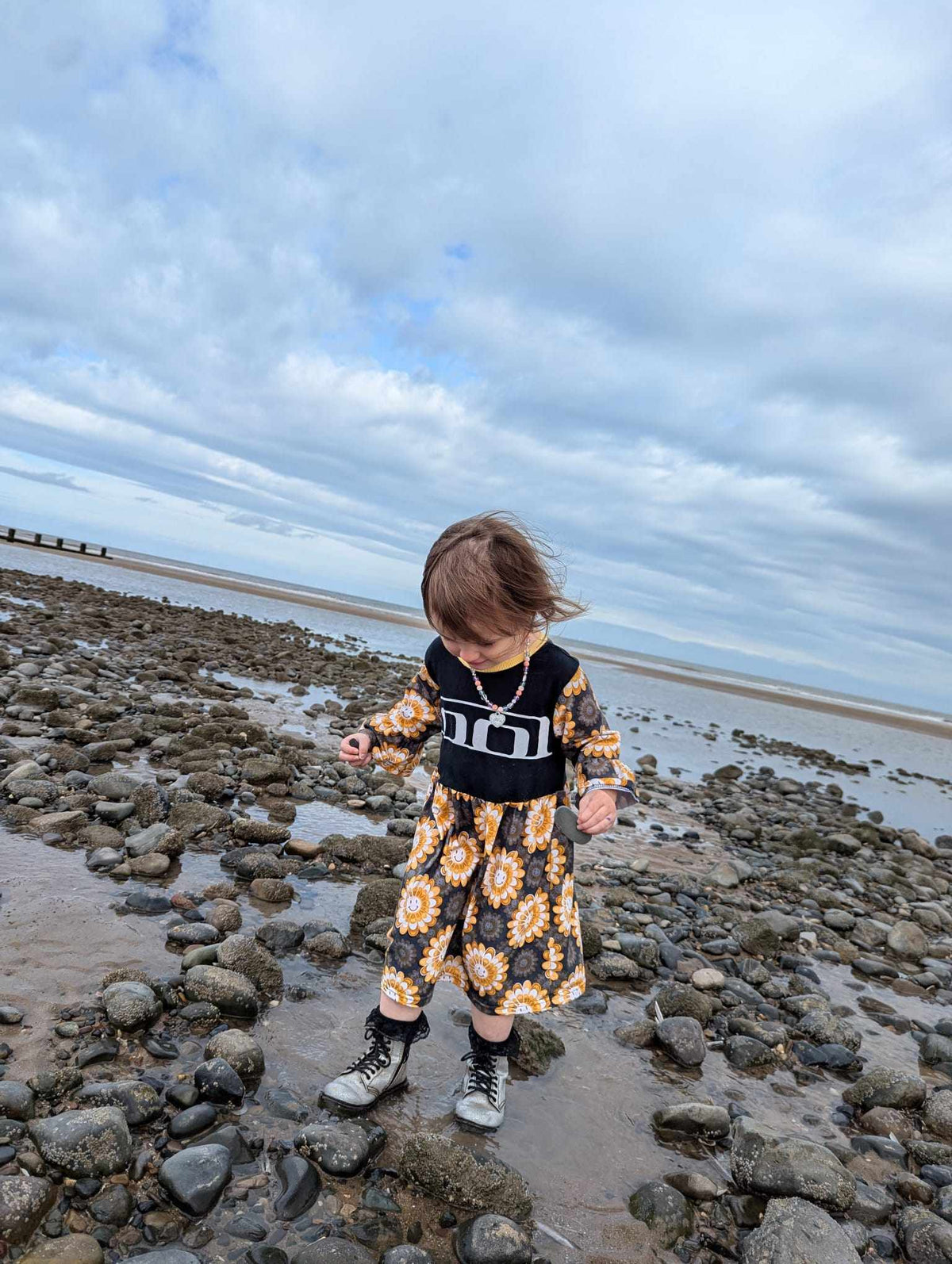 An Alt Encore customer wearing an upcycled smock from a TOOL T-shirt