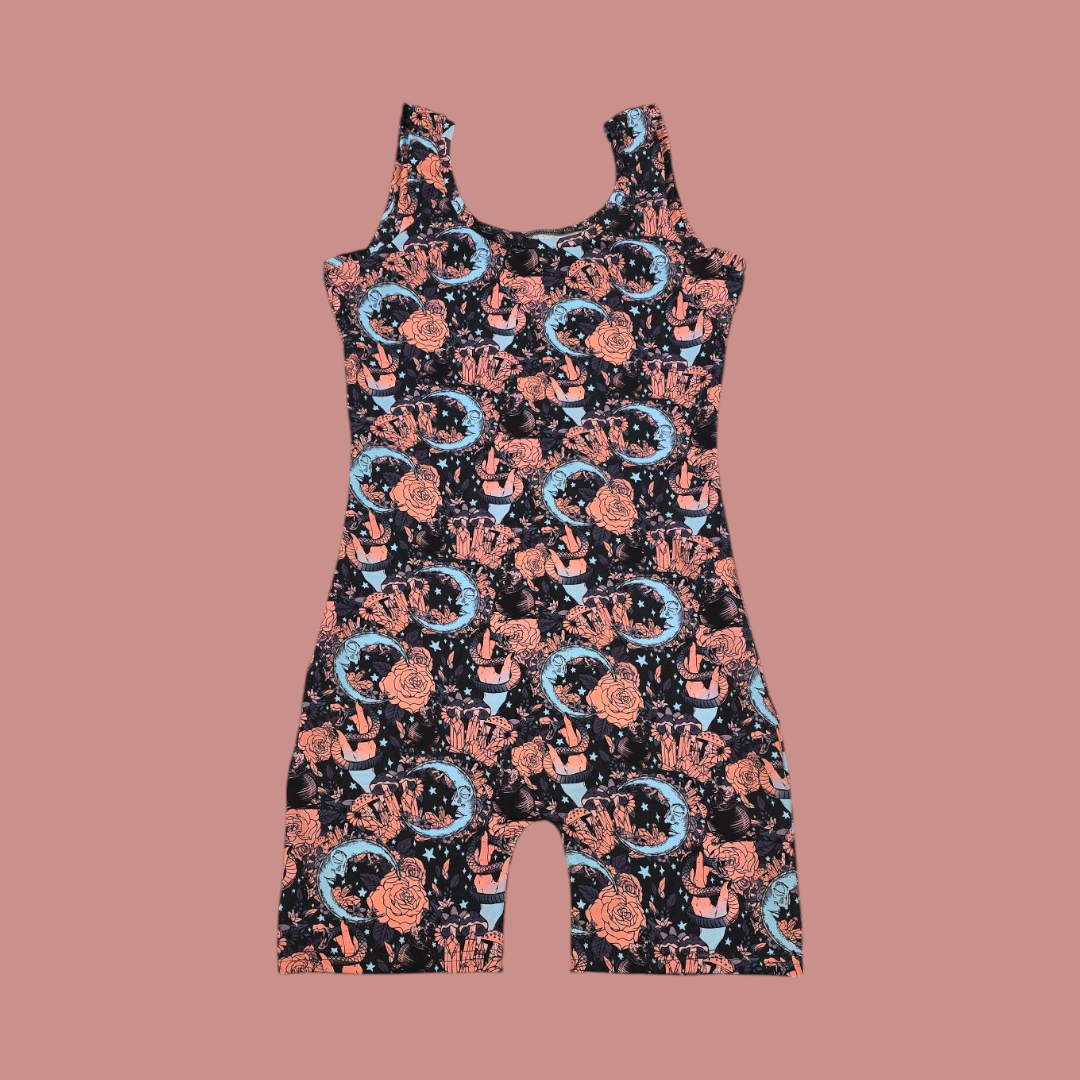 A pink and blue unitard with witchy crystals repeating pattern